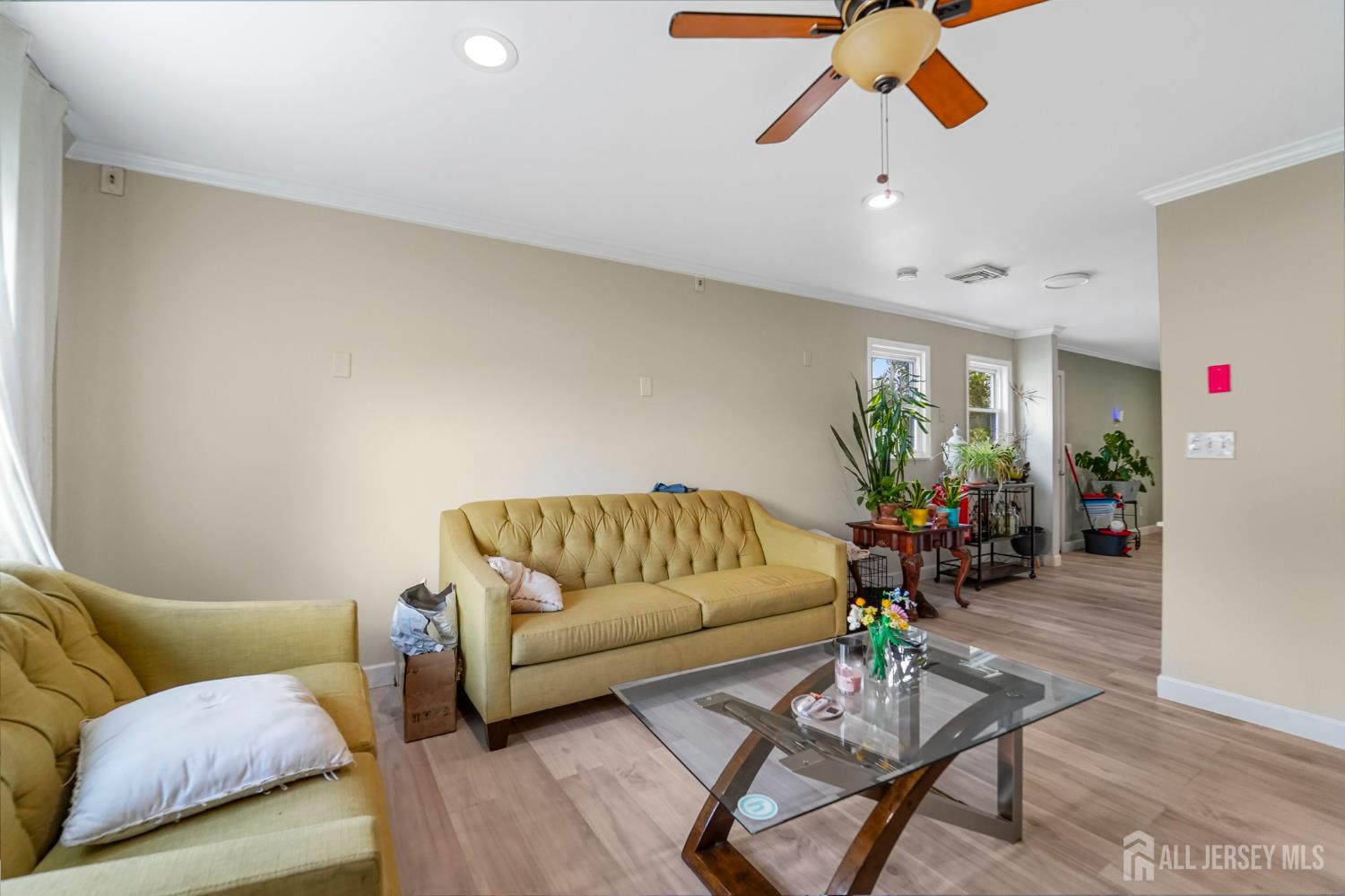 122 3rd Street Middlesex, NJ 08846 - Photo 4 of 24 a living room with furniture and wooden floor