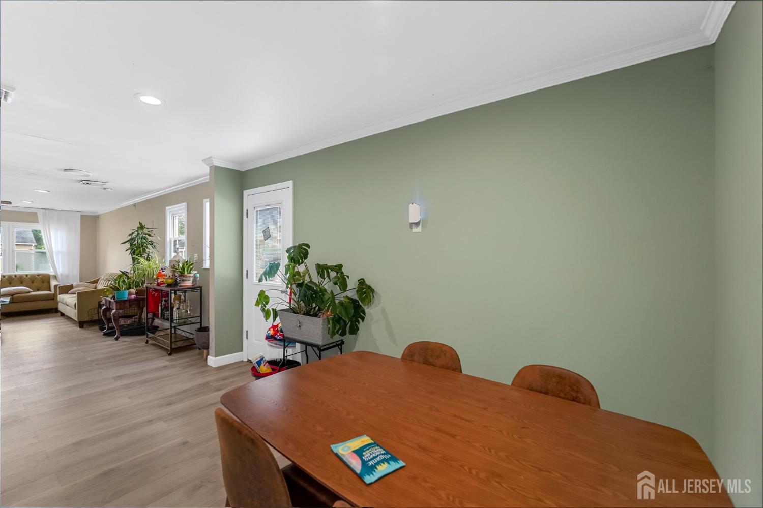 122 3rd Street Middlesex, NJ 08846 - Photo 8 of 24 a living room with furniture and potted plants