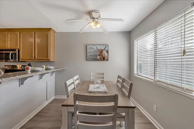a dining room with furniture and window