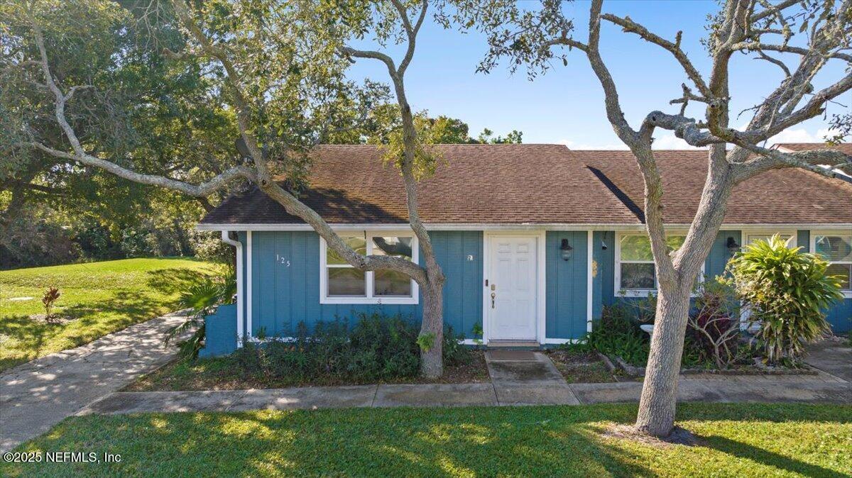 125 Rio Del Mar Street, Unit A St. Augustine, FL 32080 - Photo 20 of 30 a view of a yard in front of house