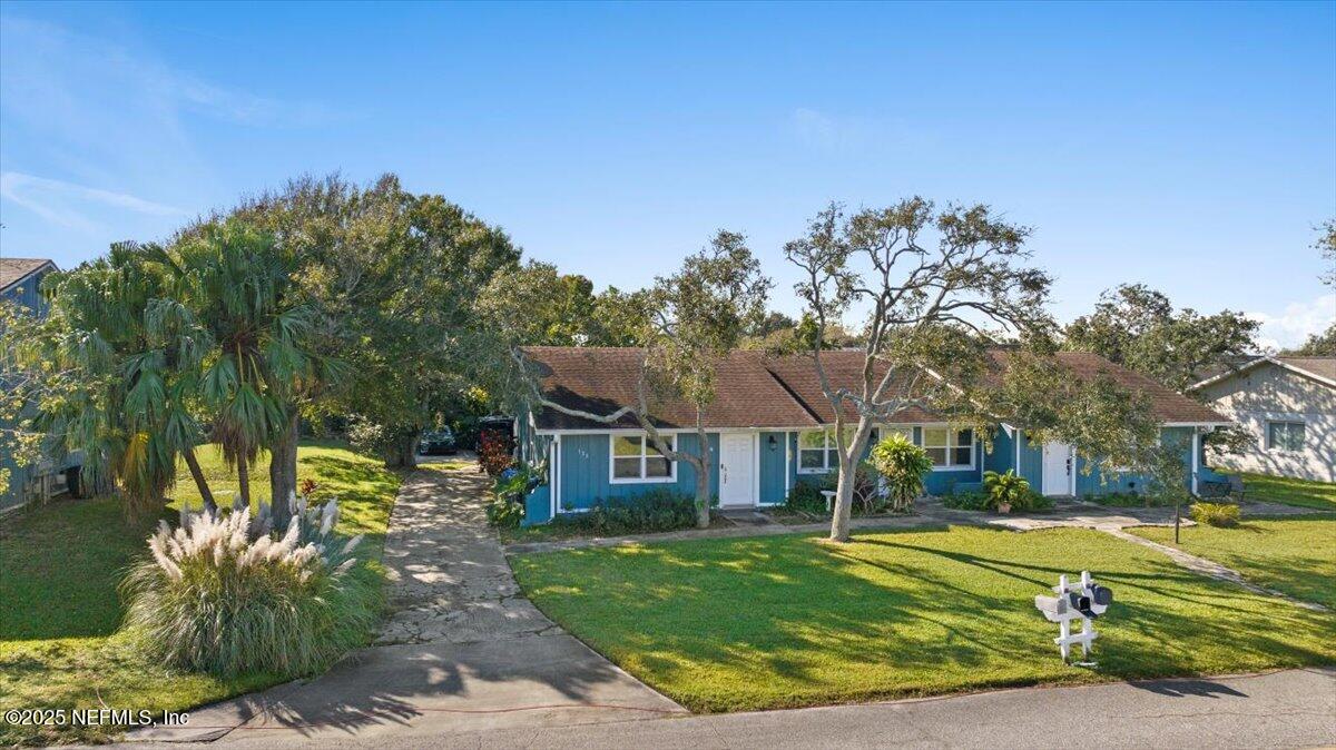 125 Rio Del Mar Street, Unit A St. Augustine, FL 32080 - Photo 21 of 30 a view of a house with a big yard