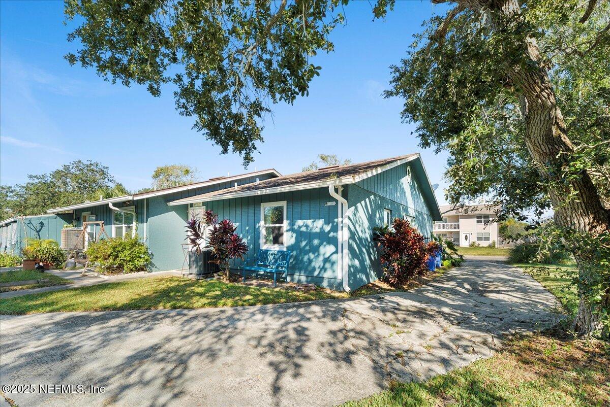 125 Rio Del Mar Street, Unit A St. Augustine, FL 32080 - Photo 26 of 30 a view of a house with a yard