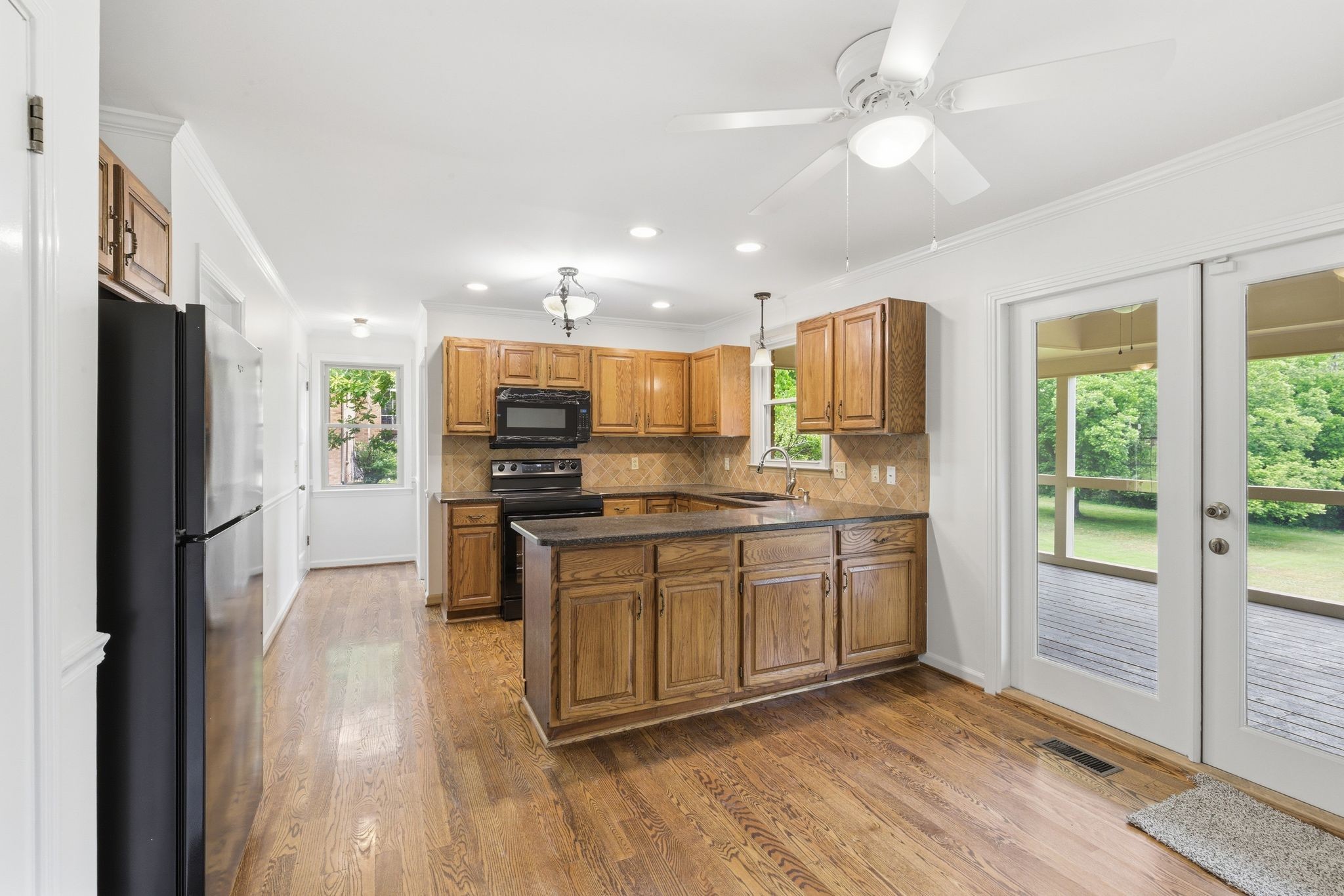 213 Rising Sun Lane Old Hickory, TN 37138 - Photo 12 of 37 a kitchen with stainless steel appliances granite countertop a refrigerator a stove a sink and a microwave