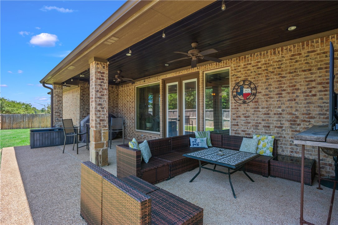 3301 Covington Court Bryan, TX 77808 - Photo 20 of 26 a outdoor living space with patio furniture and a garden