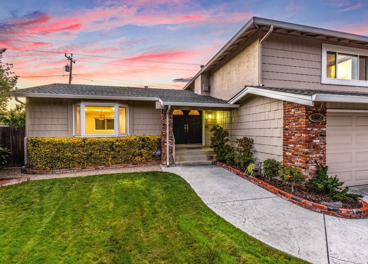a front view of a house with a yard