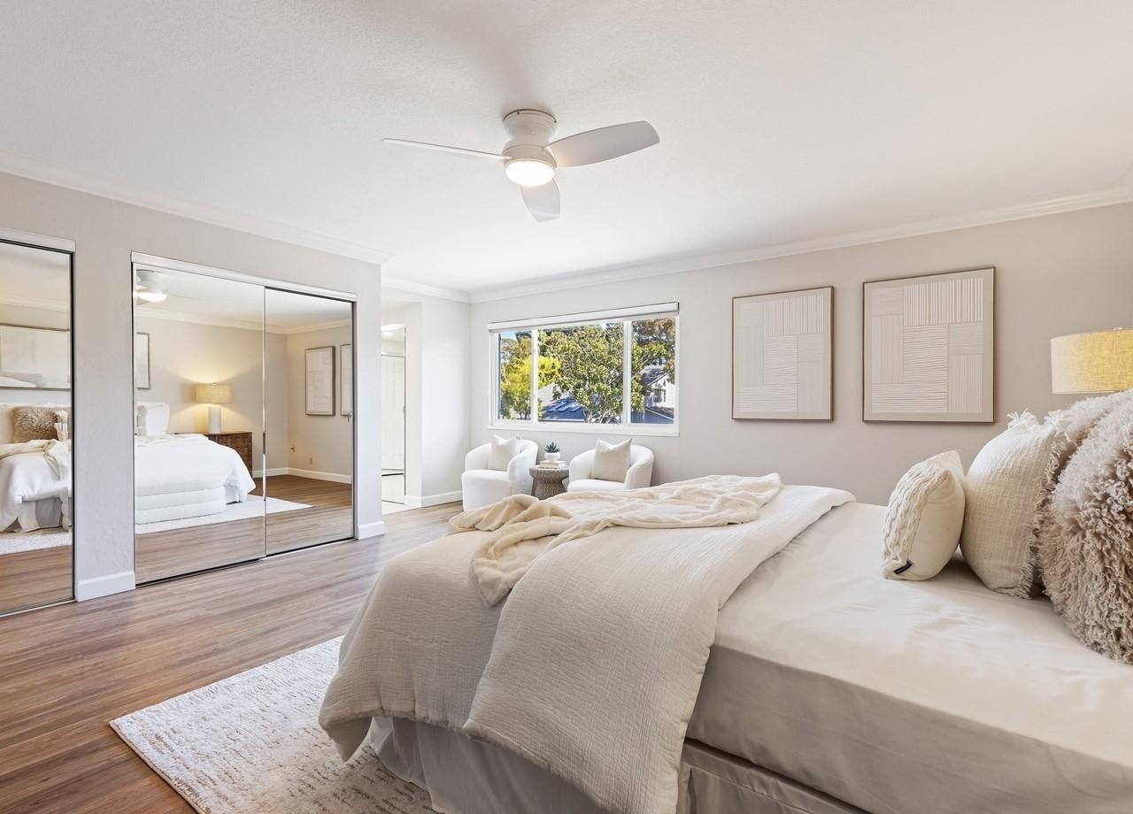 2632 Campeche Court San Ramon, CA 94583 - Photo 23 of 43 a bedroom with a large bed and a chandelier