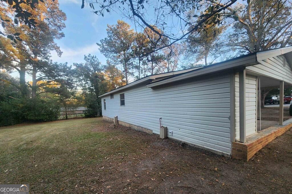 108 Madison Avenue Warner Robins, GA 31093 - Photo 3 of 7 a backyard of a house with lots of green space