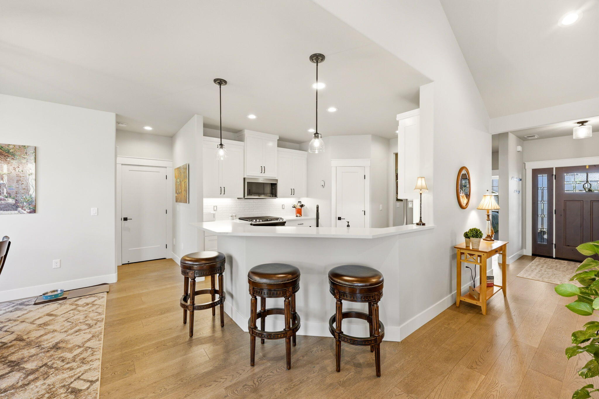 150 Timbers Lane Talent, OR 97540 - Photo 11 of 39 a kitchen with granite countertop white cabinets and chairs
