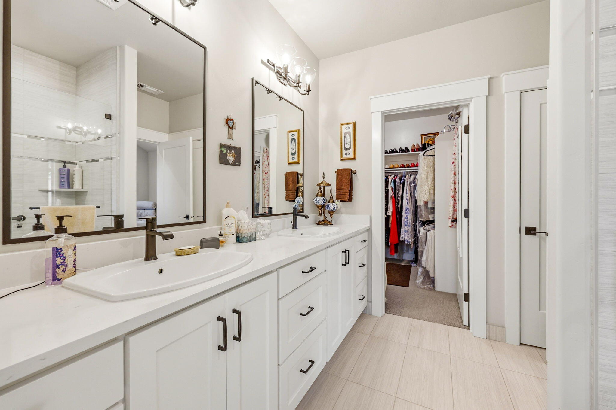 150 Timbers Lane Talent, OR 97540 - Photo 24 of 39 a bathroom with double vanity sinks and a mirror