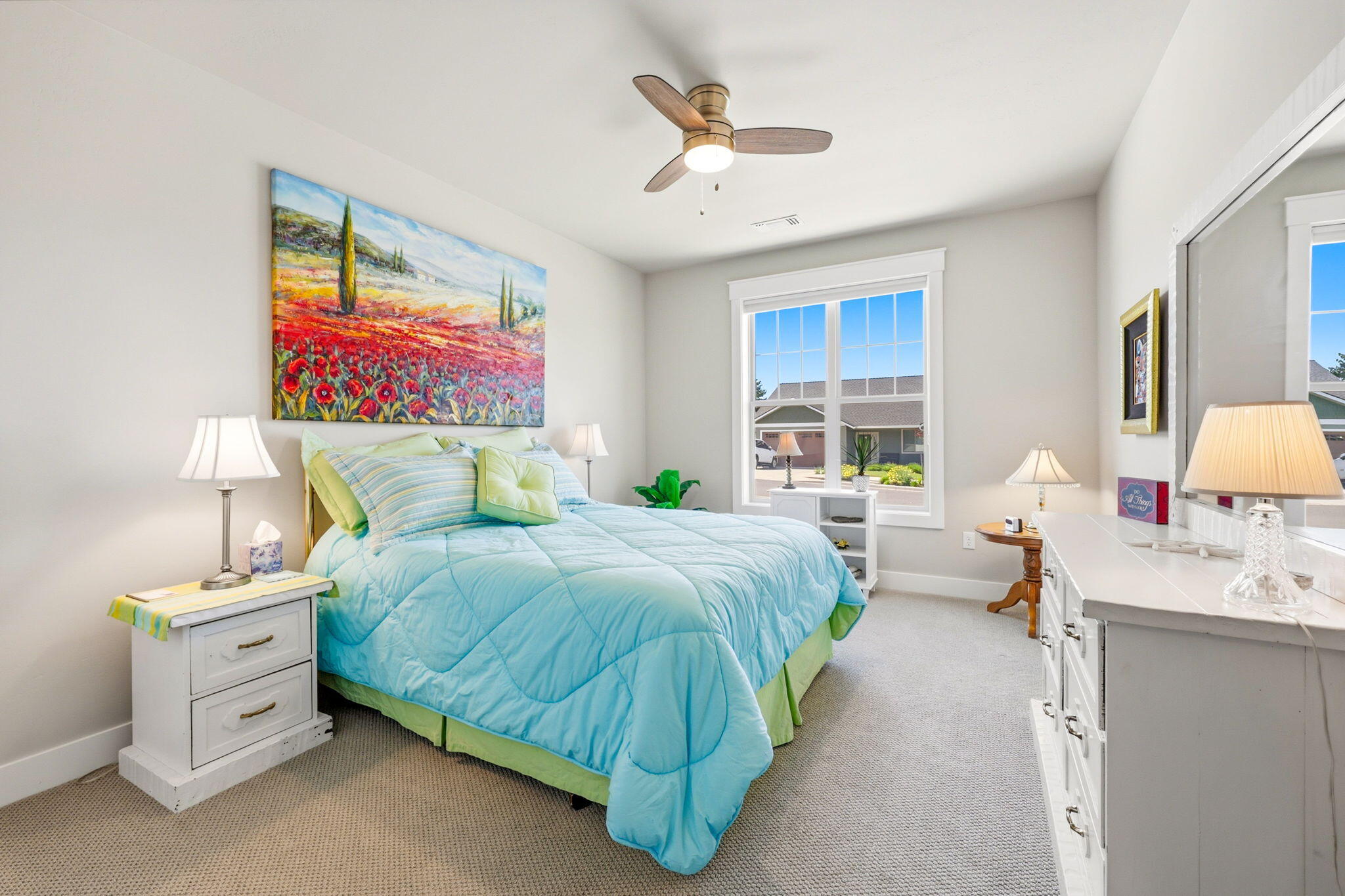 150 Timbers Lane Talent, OR 97540 - Photo 26 of 39 a spacious bedroom with a bed and a chandelier