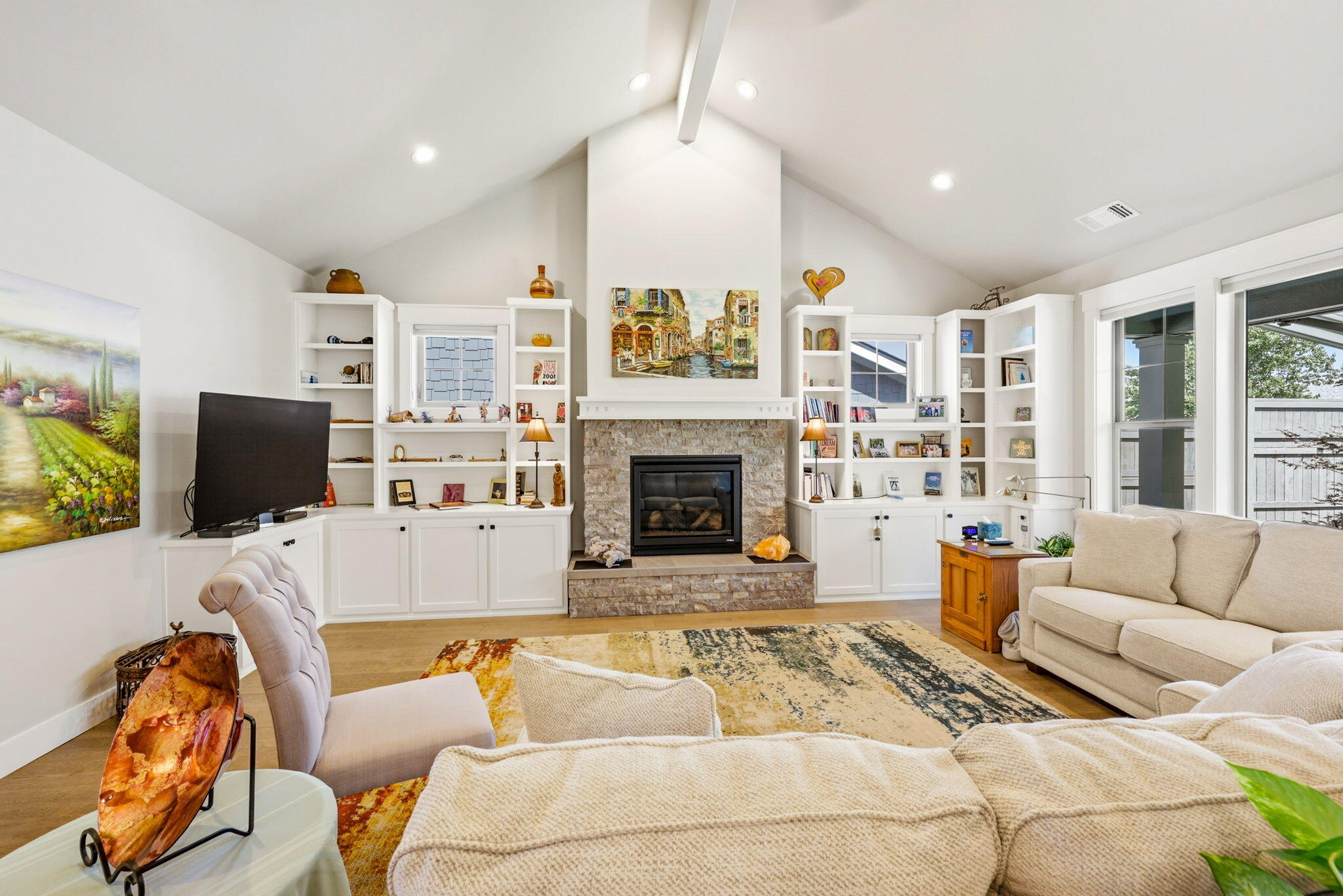 150 Timbers Lane Talent, OR 97540 - Photo 7 of 39 a living room with furniture a fireplace and a flat screen tv