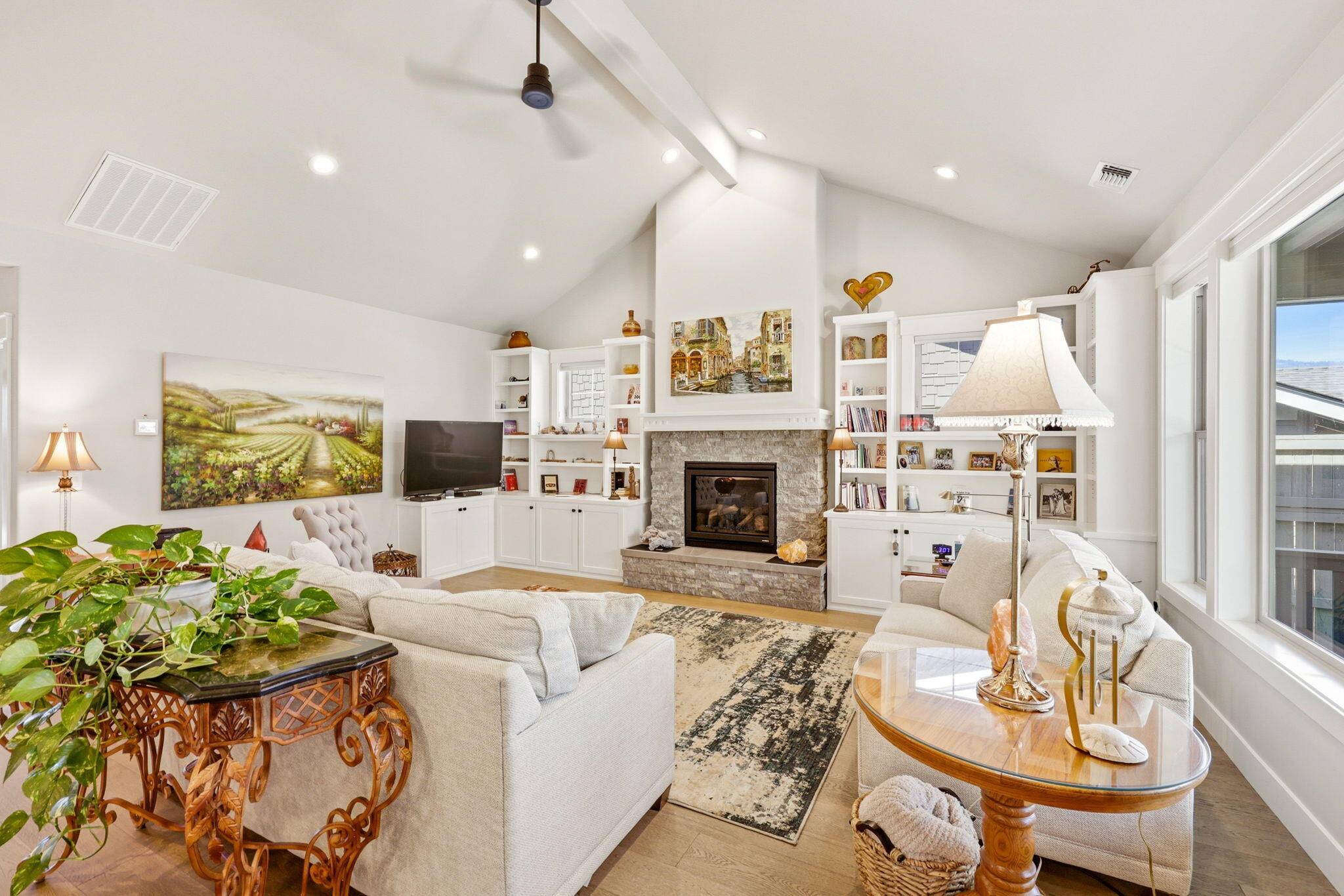150 Timbers Lane Talent, OR 97540 - Photo 8 of 39 a living room with furniture a fireplace and a flat screen tv