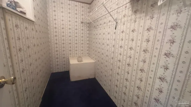 a bathroom with a shower and a sink