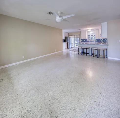 a view of a livingroom with furniture and window