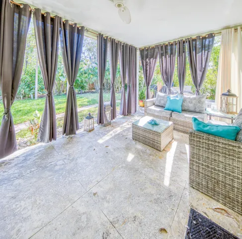 a living room filled with furniture and a garden