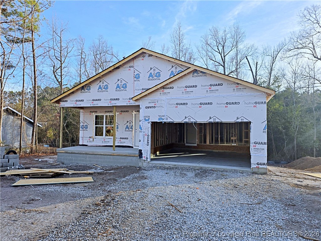 309 Appaloosa Drive Spring Lake, NC 28390 - Photo 2 of 4 a front view of a house with a yard and garage