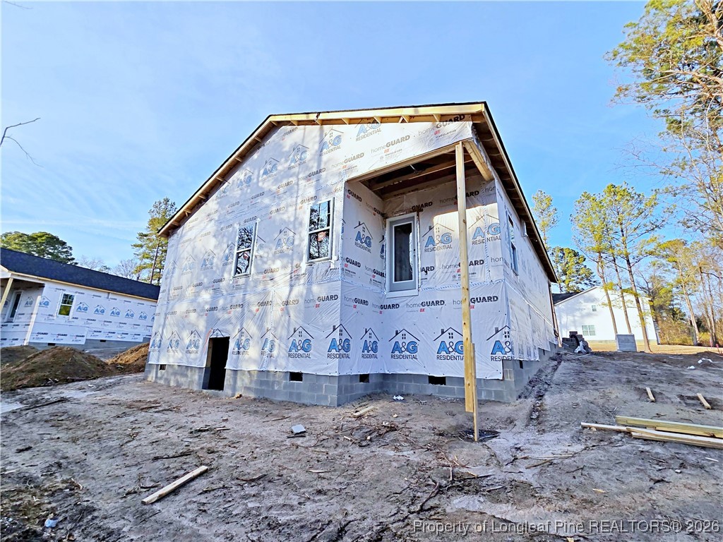 309 Appaloosa Drive Spring Lake, NC 28390 - Photo 3 of 4 a front view of a house with a yard