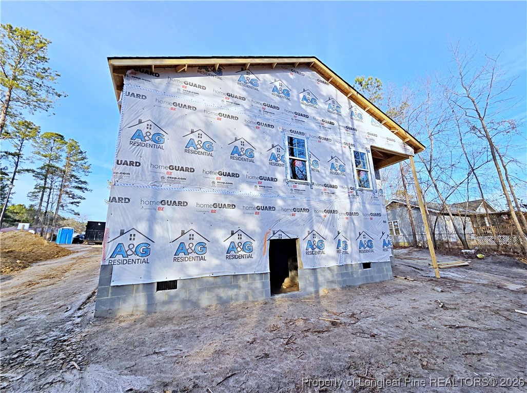 309 Appaloosa Drive Spring Lake, NC 28390 - Photo 4 of 4 a front view of a house with parking area