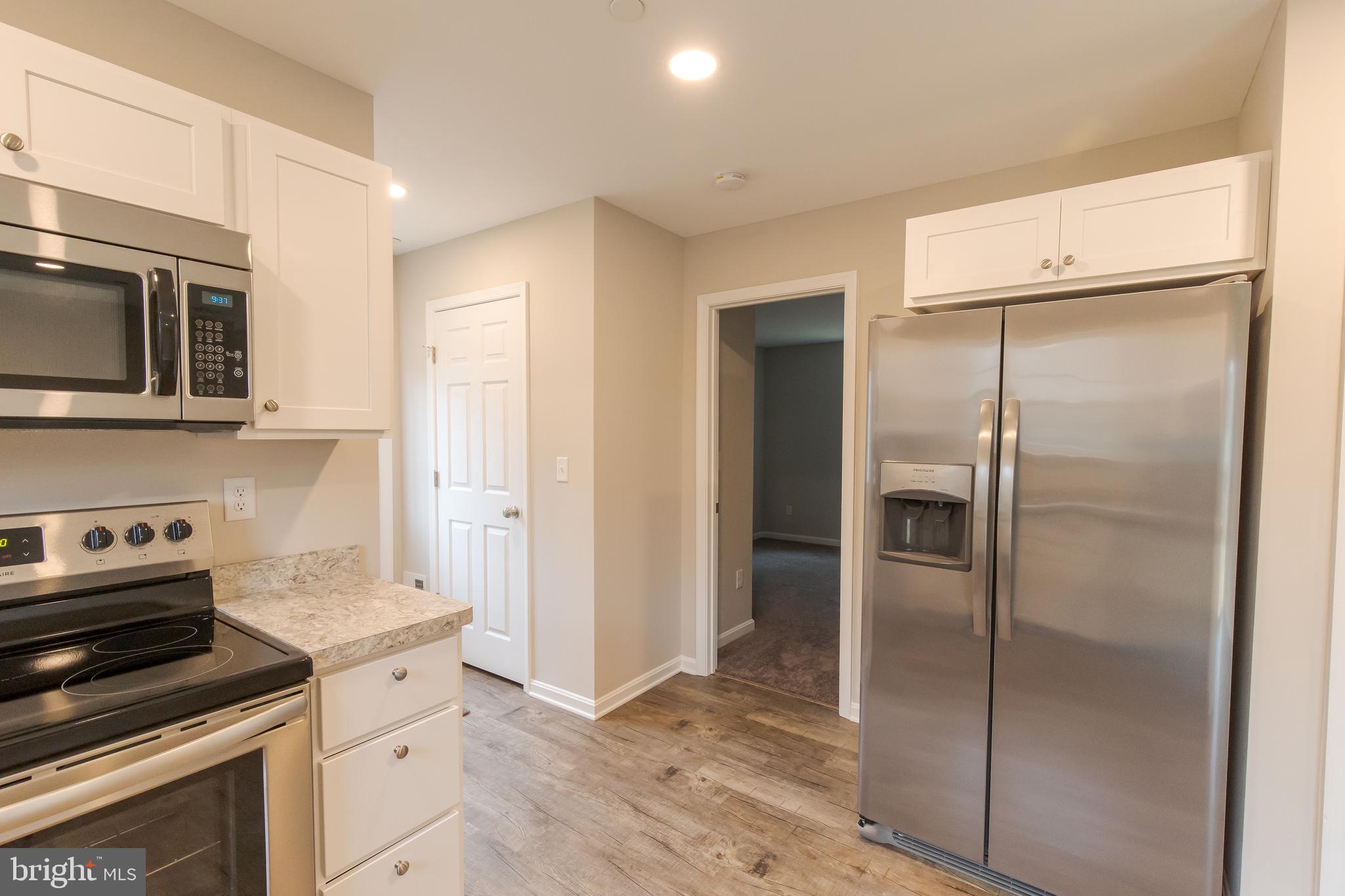First room that leads off of kitchen