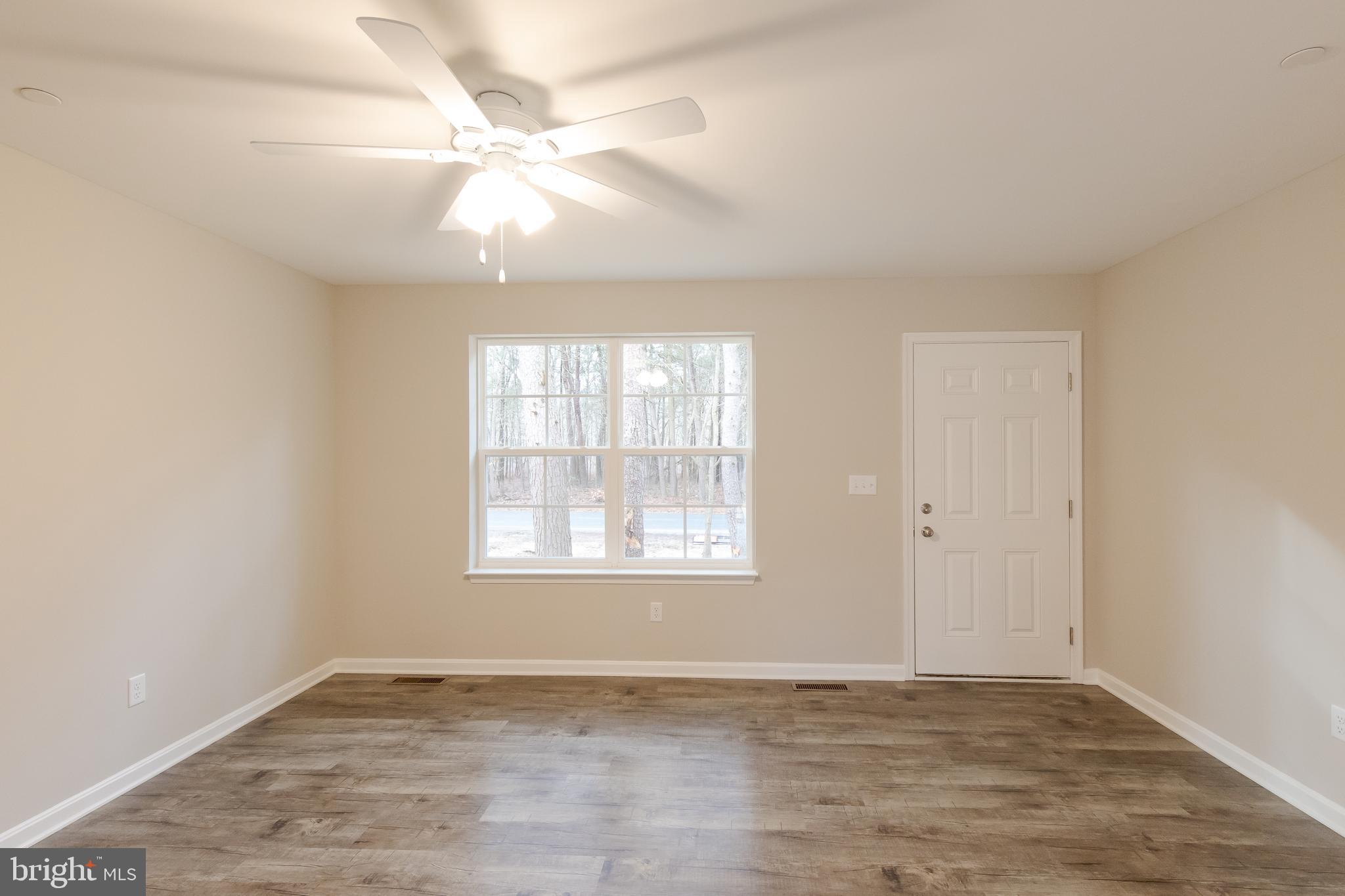 Living room with ceiling fan/light