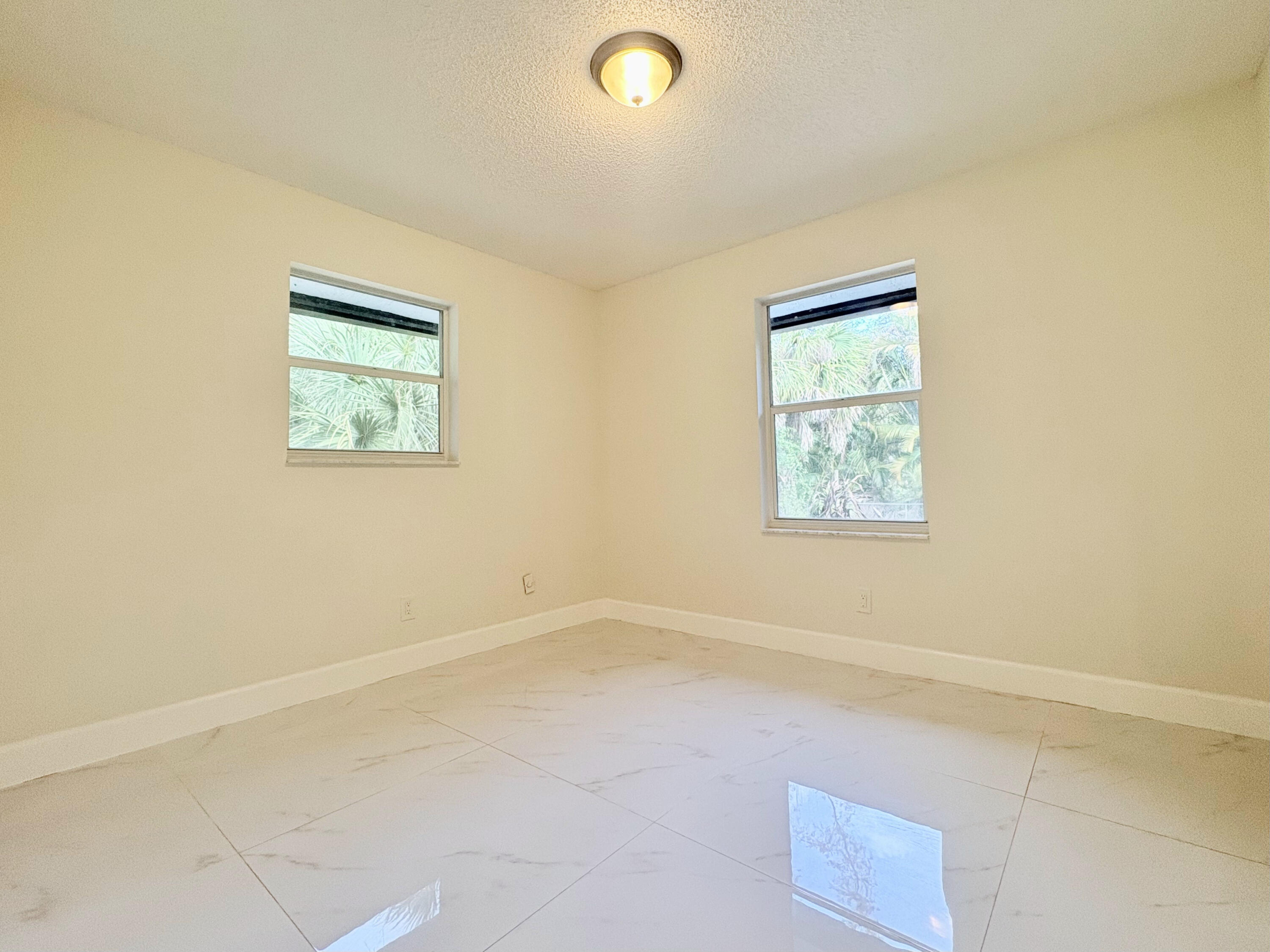 14523 Flamingo Road Loxahatchee Groves, FL 33470 - Photo 35 of 50 an empty room with a window