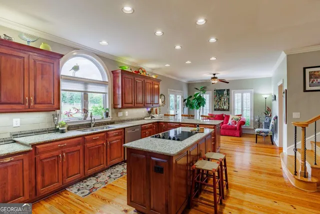 a bedroom with bed and wooden floor