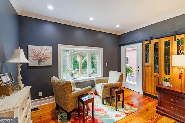 a bedroom with furniture and a chandelier fan
