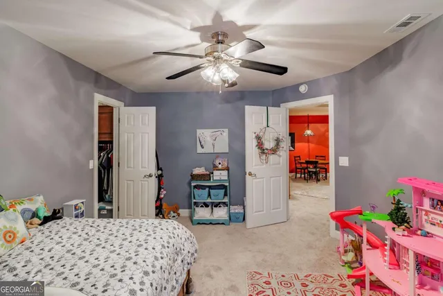 a view of dirt field with trees in the background