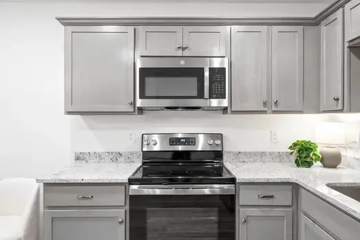 a kitchen with a sink and cabinets