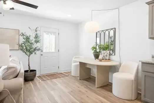 a living room with furniture and a table