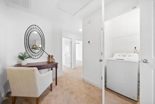 a view of a workspace with furniture and wooden floor