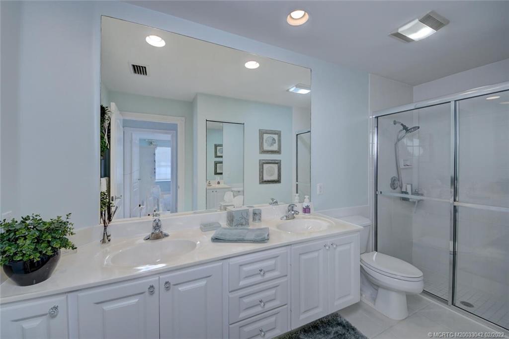 786 Southwest Balmoral Trace Stuart, FL 34997 - Photo 23 of 35 Master Bathroom with dual sinks and separate shower