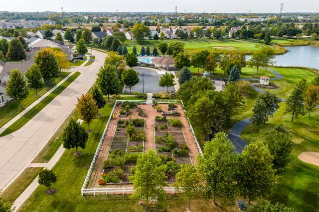 an aerial view of residential houses with outdoor space