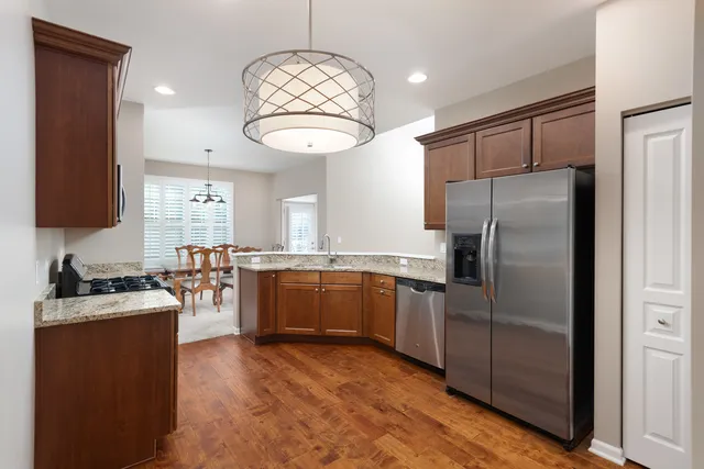 a kitchen with cabinets and stainless steel appliances