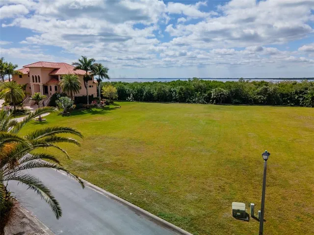 a view of a lake with a yard