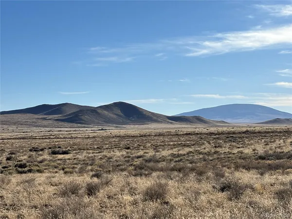 a view of an ocean with a mountain