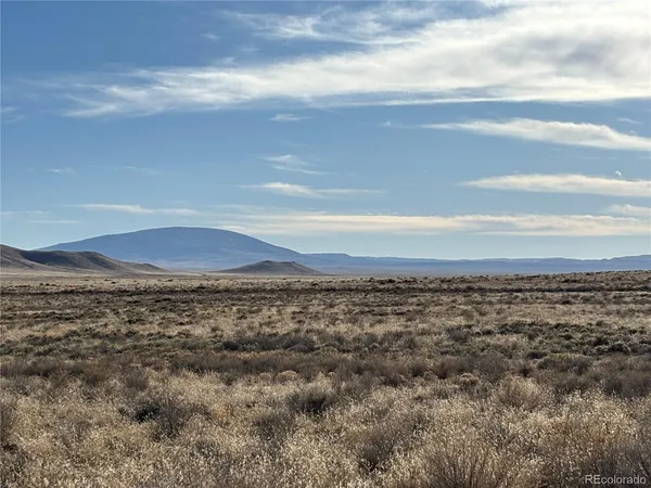 a view of an ocean and mountain