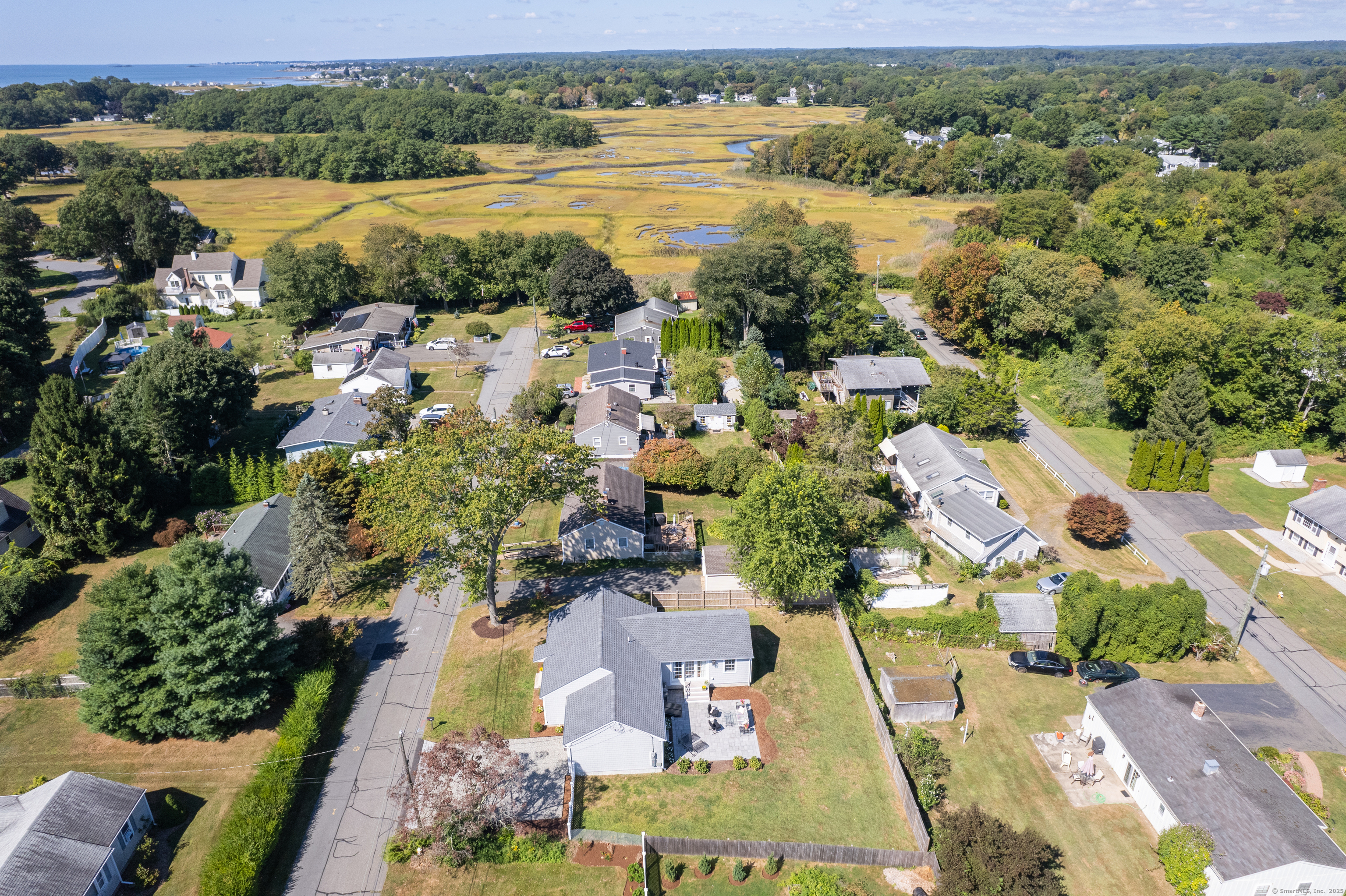 an aerial view of a city with lake view