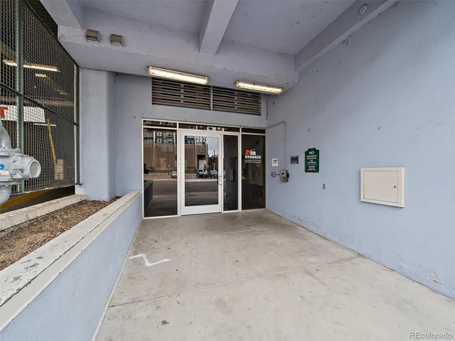 a view of an empty room with a fireplace