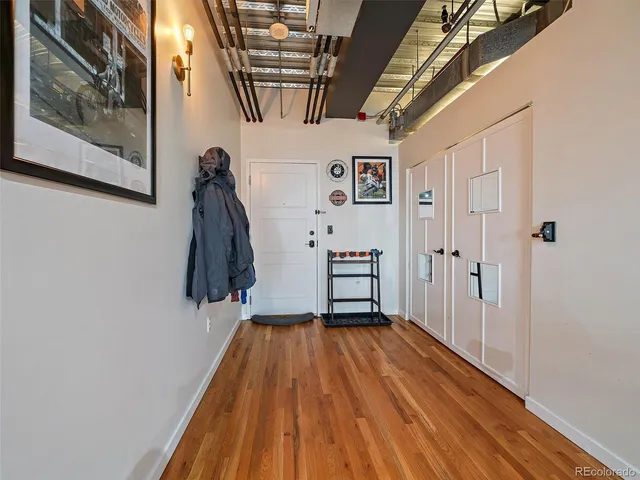 a view of entryway with wooden floor