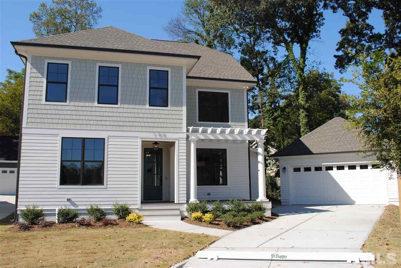 a front view of a house with yard