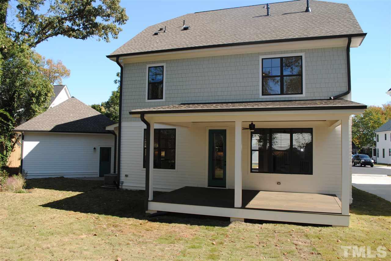 106 Revival Way Raleigh, NC 27608 - Photo 2 of 25 a front view of a house with a yard