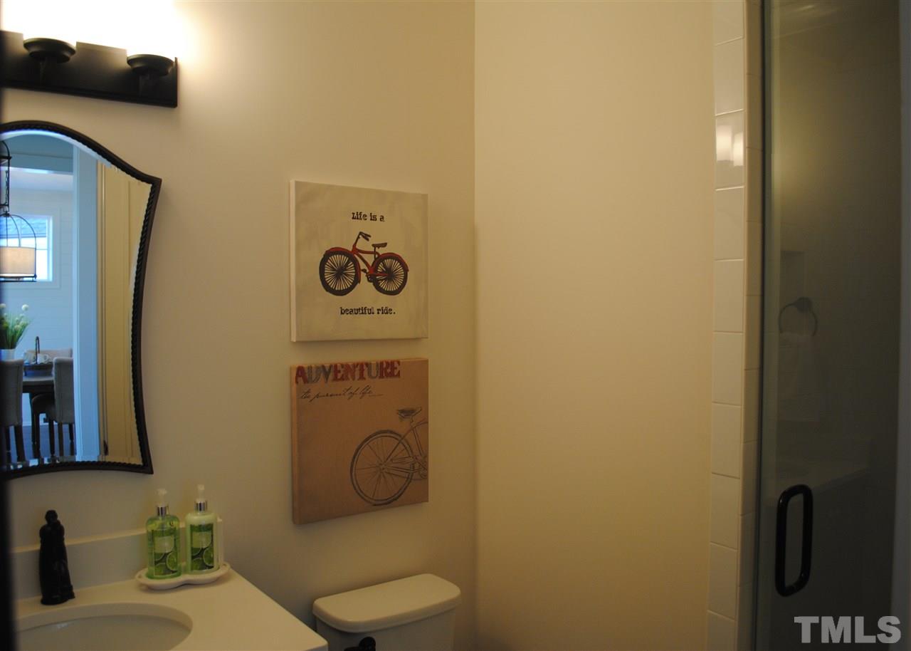 106 Revival Way Raleigh, NC 27608 - Photo 12 of 25 a bathroom with a toilet and a sink