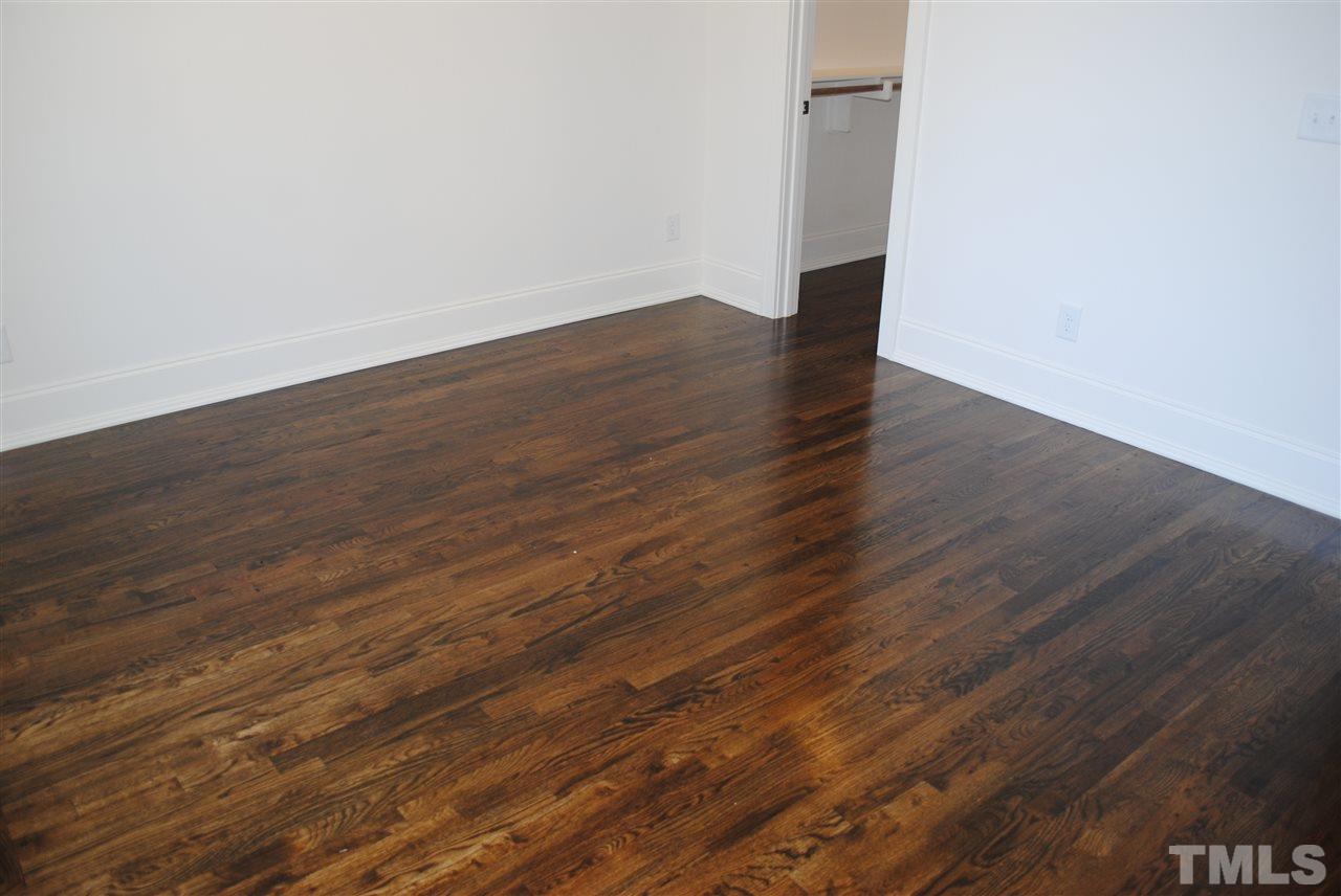 106 Revival Way Raleigh, NC 27608 - Photo 13 of 25 wooden floor in a empty room