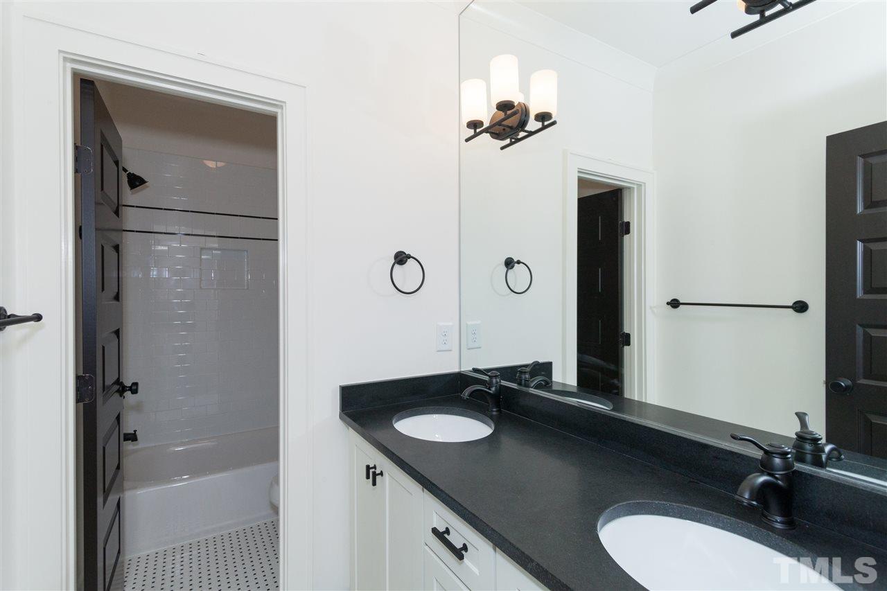 106 Revival Way Raleigh, NC 27608 - Photo 15 of 25 a bathroom with a sink vanity granite tub and mirror