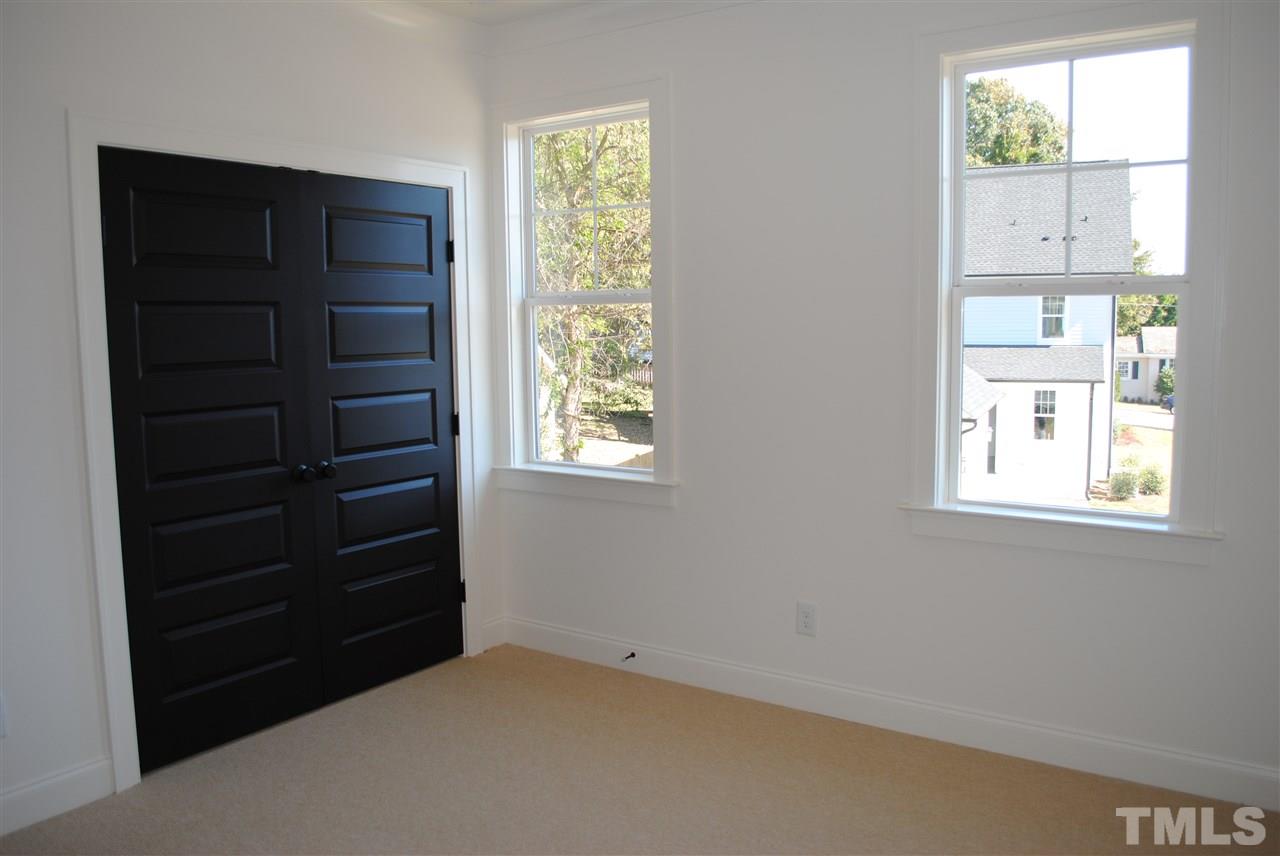 106 Revival Way Raleigh, NC 27608 - Photo 16 of 25 an empty room with windows and closet