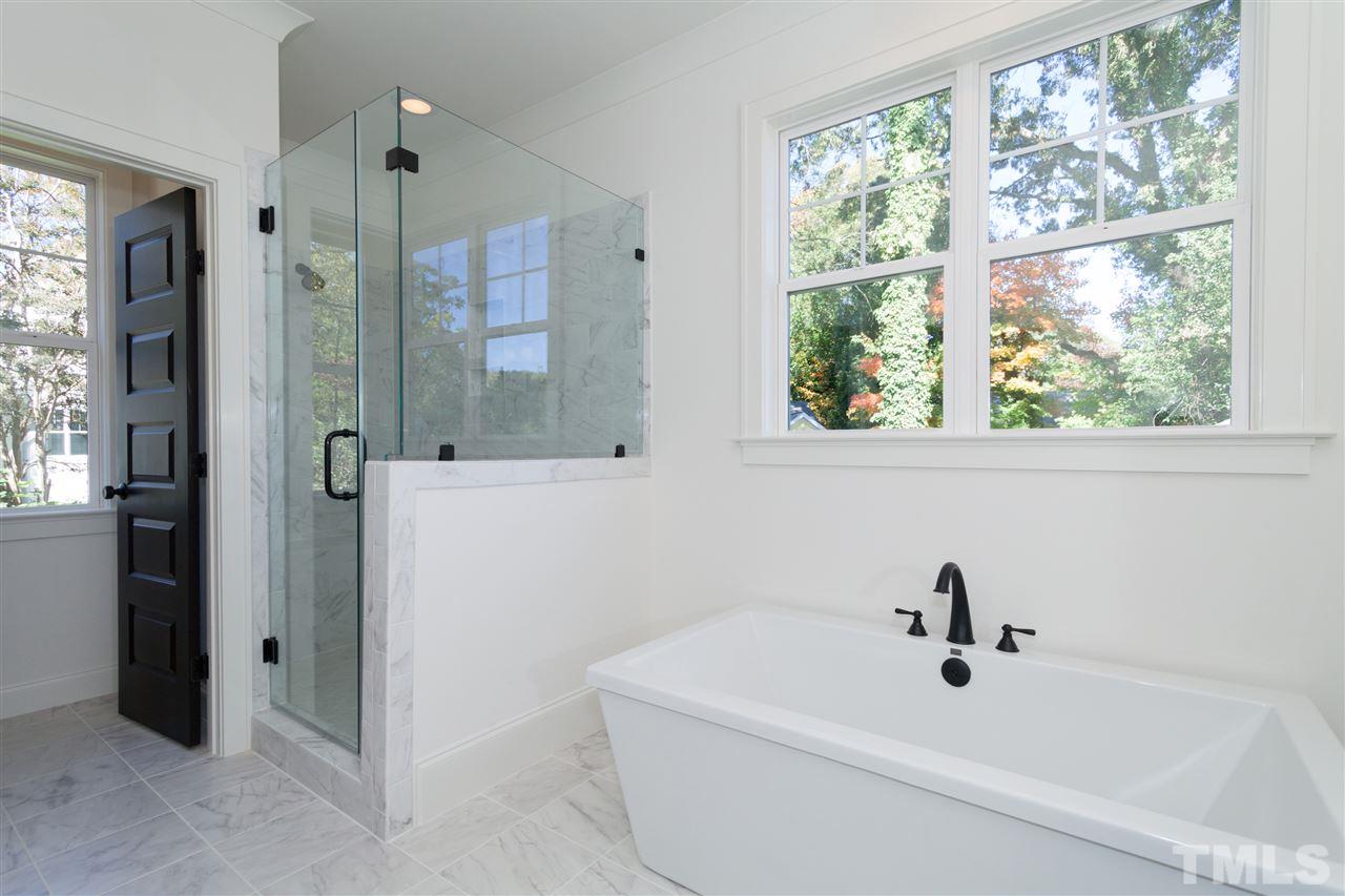 106 Revival Way Raleigh, NC 27608 - Photo 19 of 25 a bathroom with a bathtub and a shower