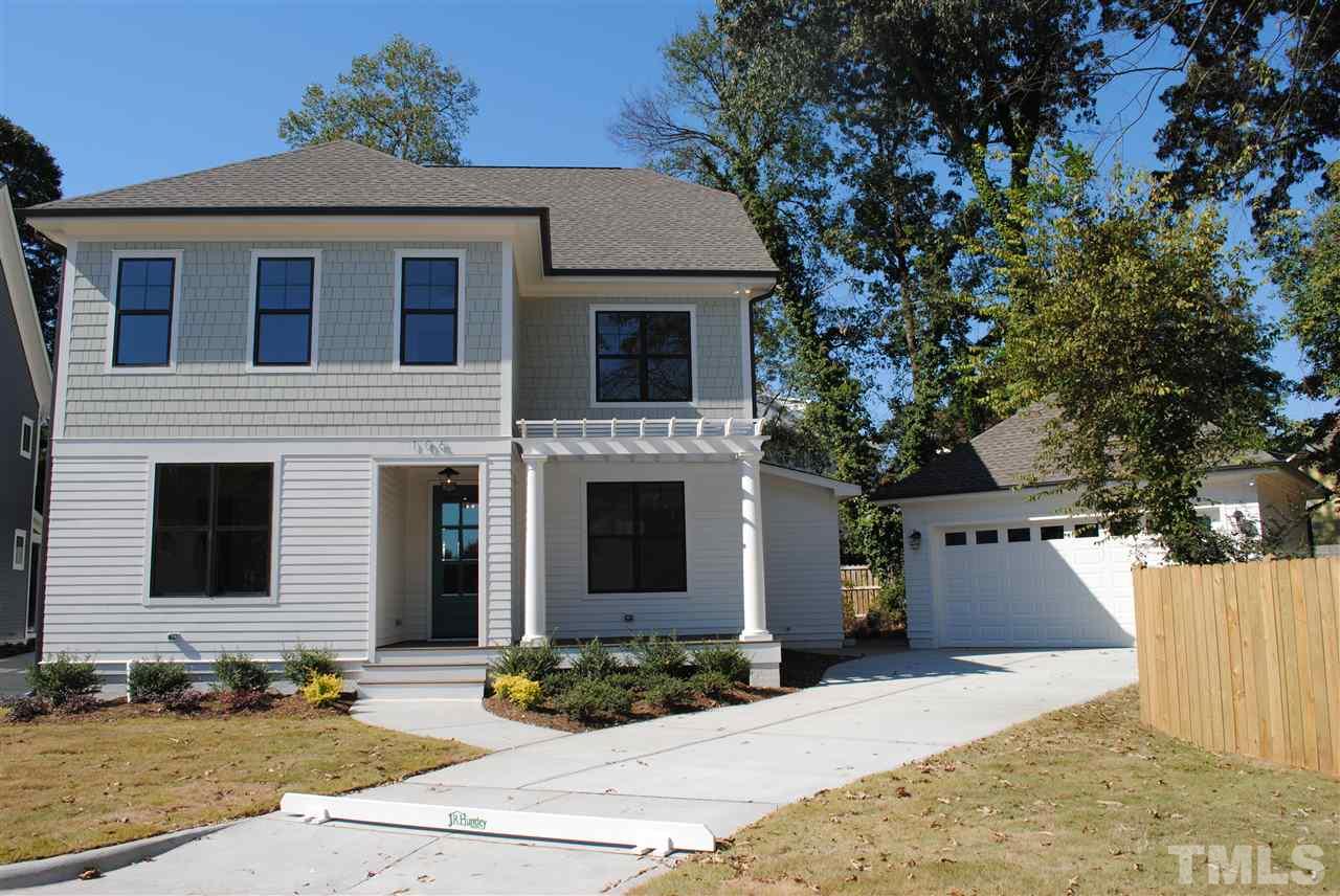 106 Revival Way Raleigh, NC 27608 - Photo 25 of 25 a front view of a house with a yard and garage