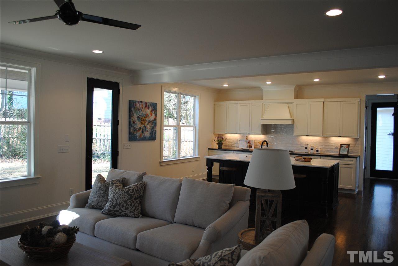 106 Revival Way Raleigh, NC 27608 - Photo 6 of 25 a living room with furniture kitchen view and a window