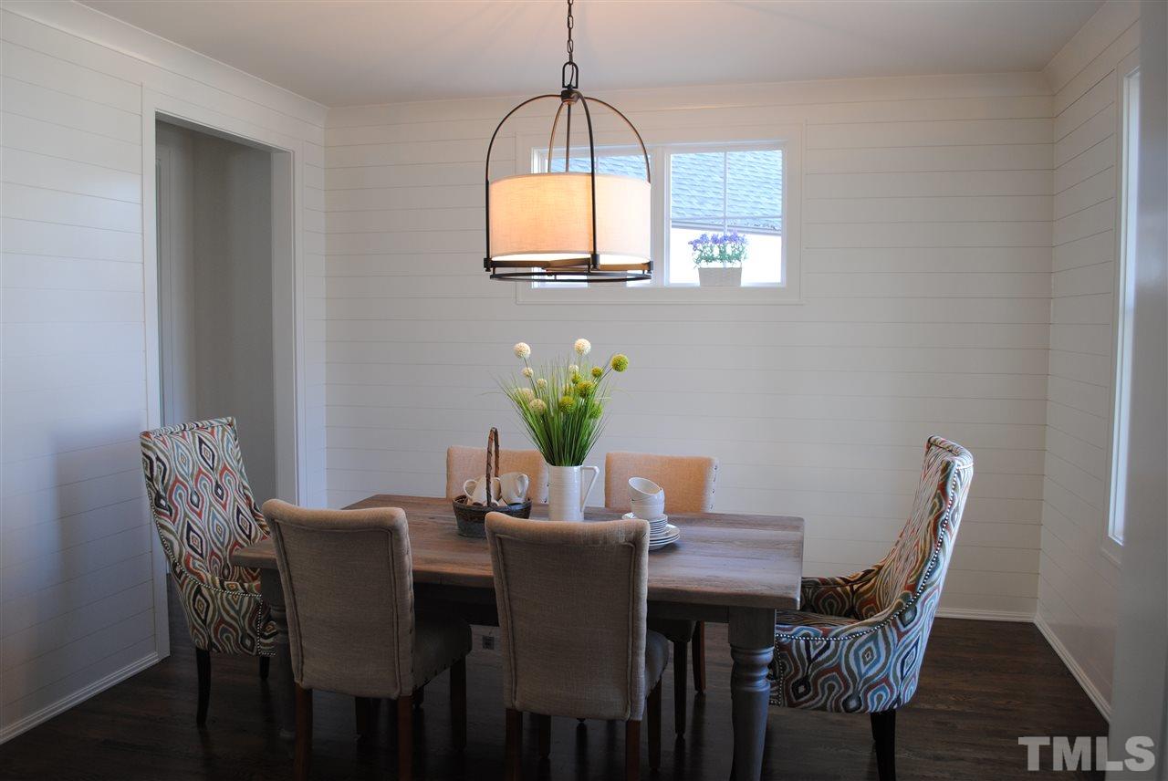 106 Revival Way Raleigh, NC 27608 - Photo 9 of 25 a view of a dining room with furniture and window